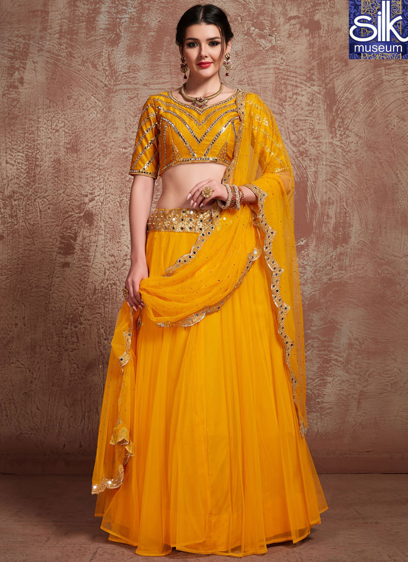 13917 Magnetic Mustard Color Soft Net Designer Traditional Wear Lehenga Choli