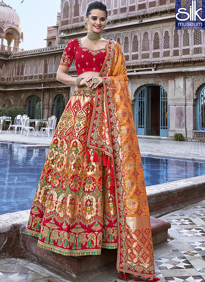 14066 Attractive Peach And Orange Color Banarasi Silk Designer Traditional Wear Lehenga Choli