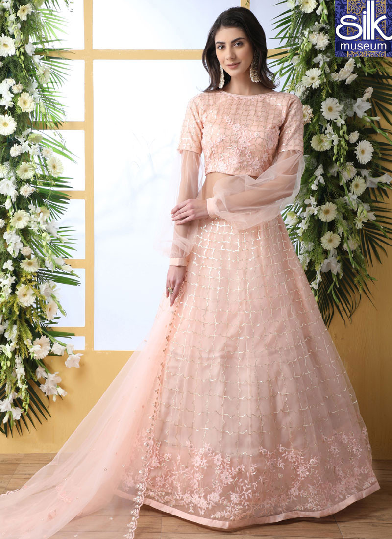 Sparkling Peach Color Soft Net New Designer Traditional Wear Lehenga Choli