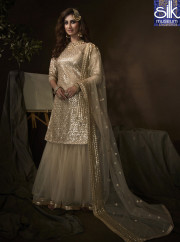 Attractive Dusty Beige Color Soft Net New Designer Party Wear Garara Suit