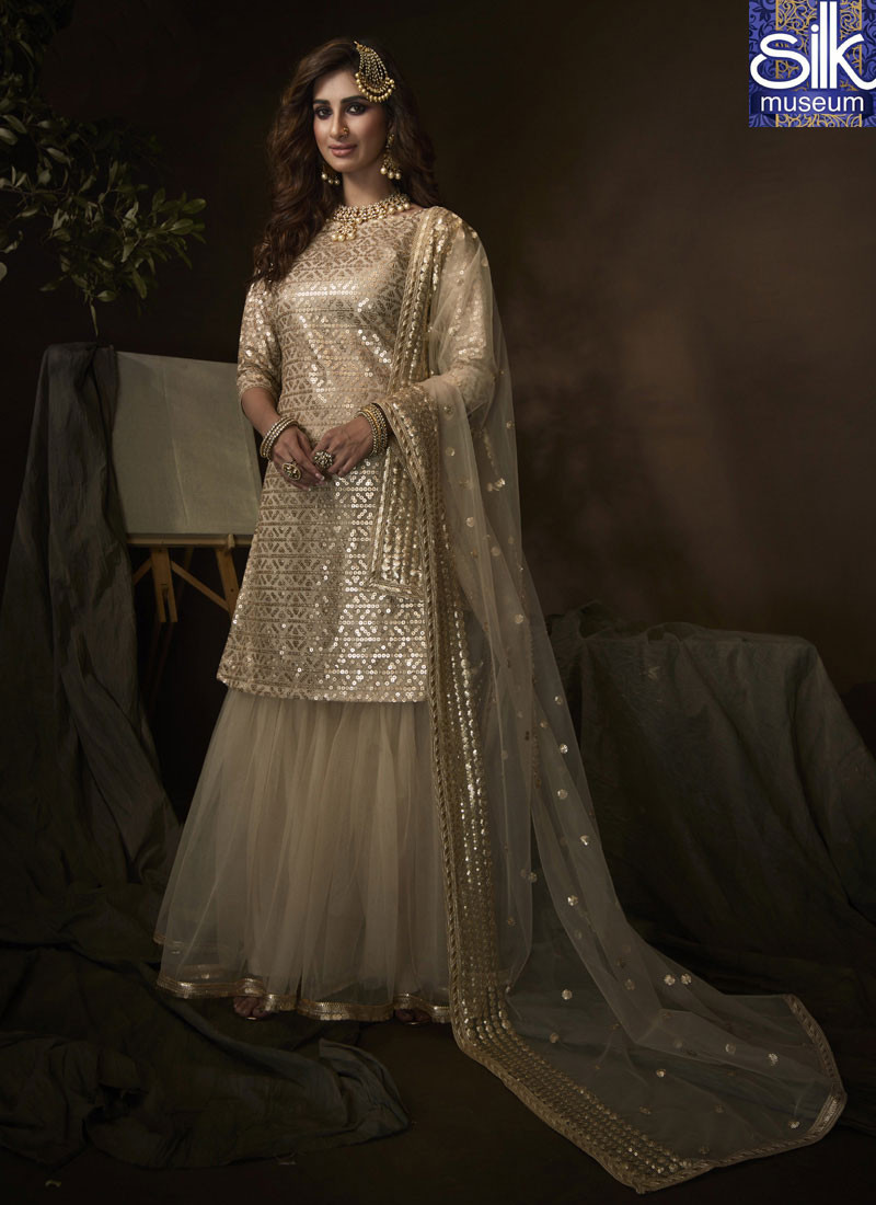 14437 Attractive Dusty Beige Color Soft Net New Designer Party Wear Garara Suit