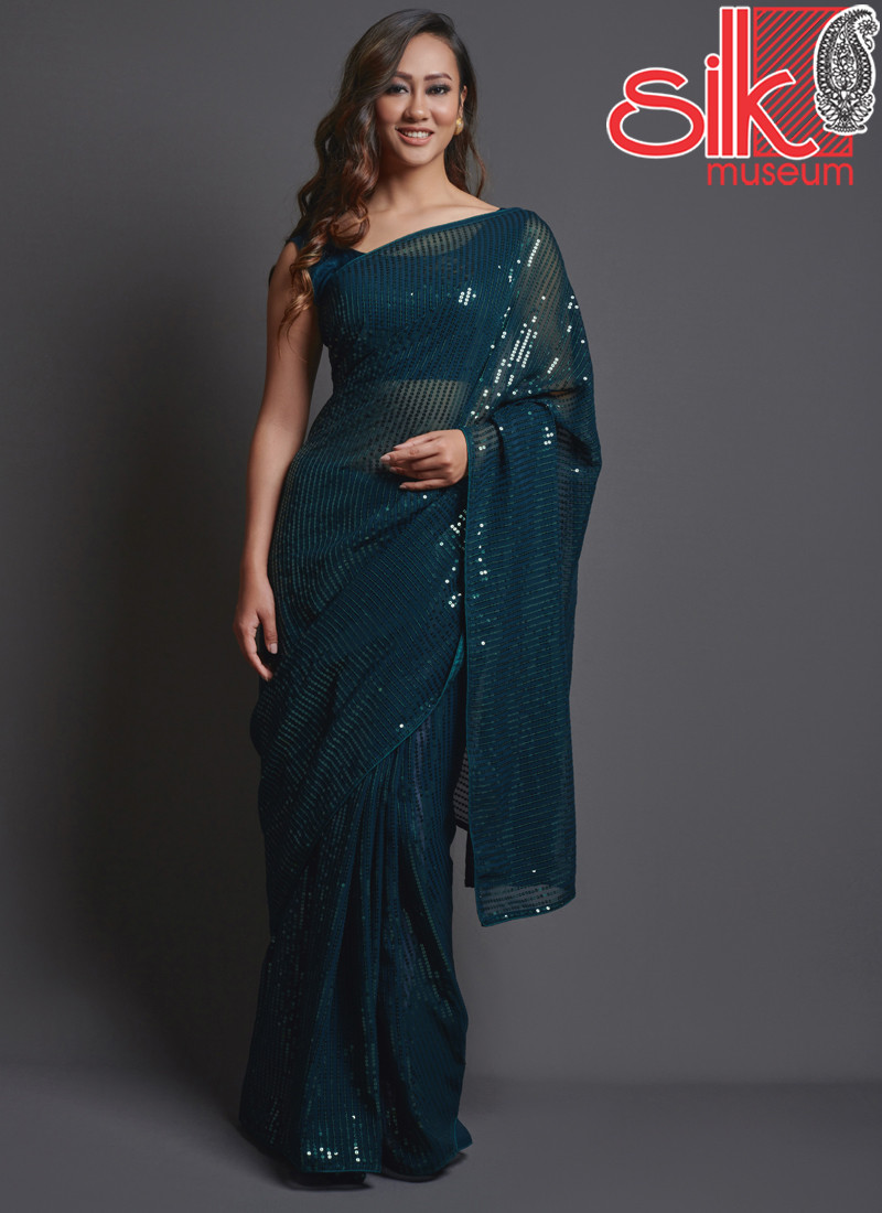 14778 Teal Georgette Embellished Saree With Blouse Piece